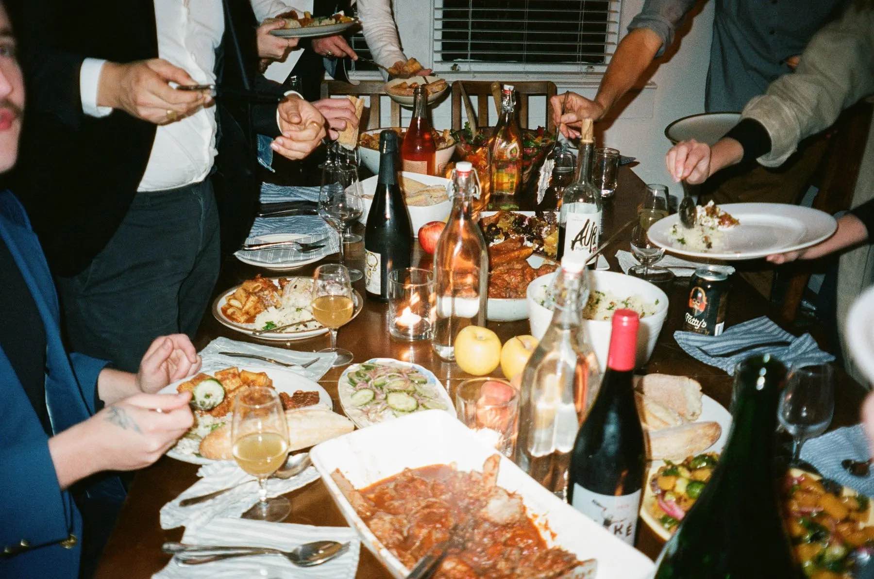 Friends sharing a meal at a small-group Outpost dinner